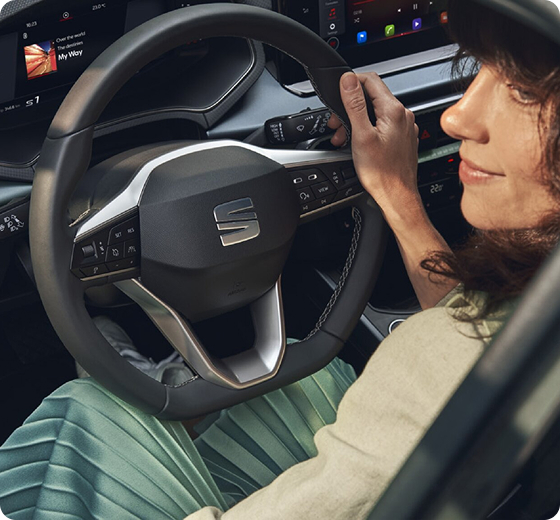 close up. of woman holding steering wheel
