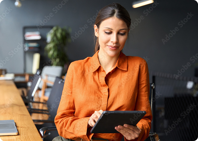 person with orange shirt working in cafe