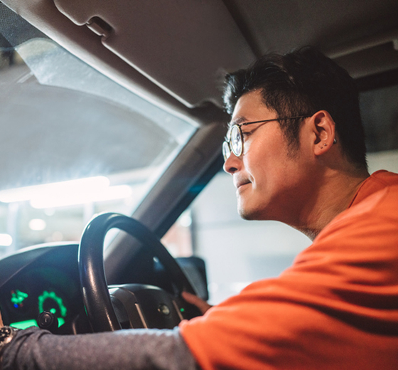 close-up of business person driving a van