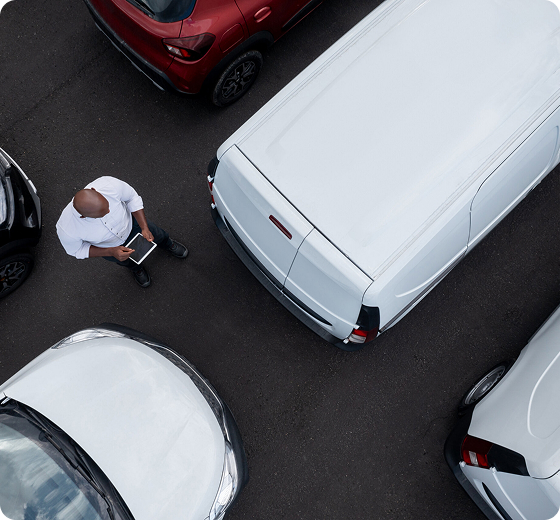 close-up of business person standing next to a van